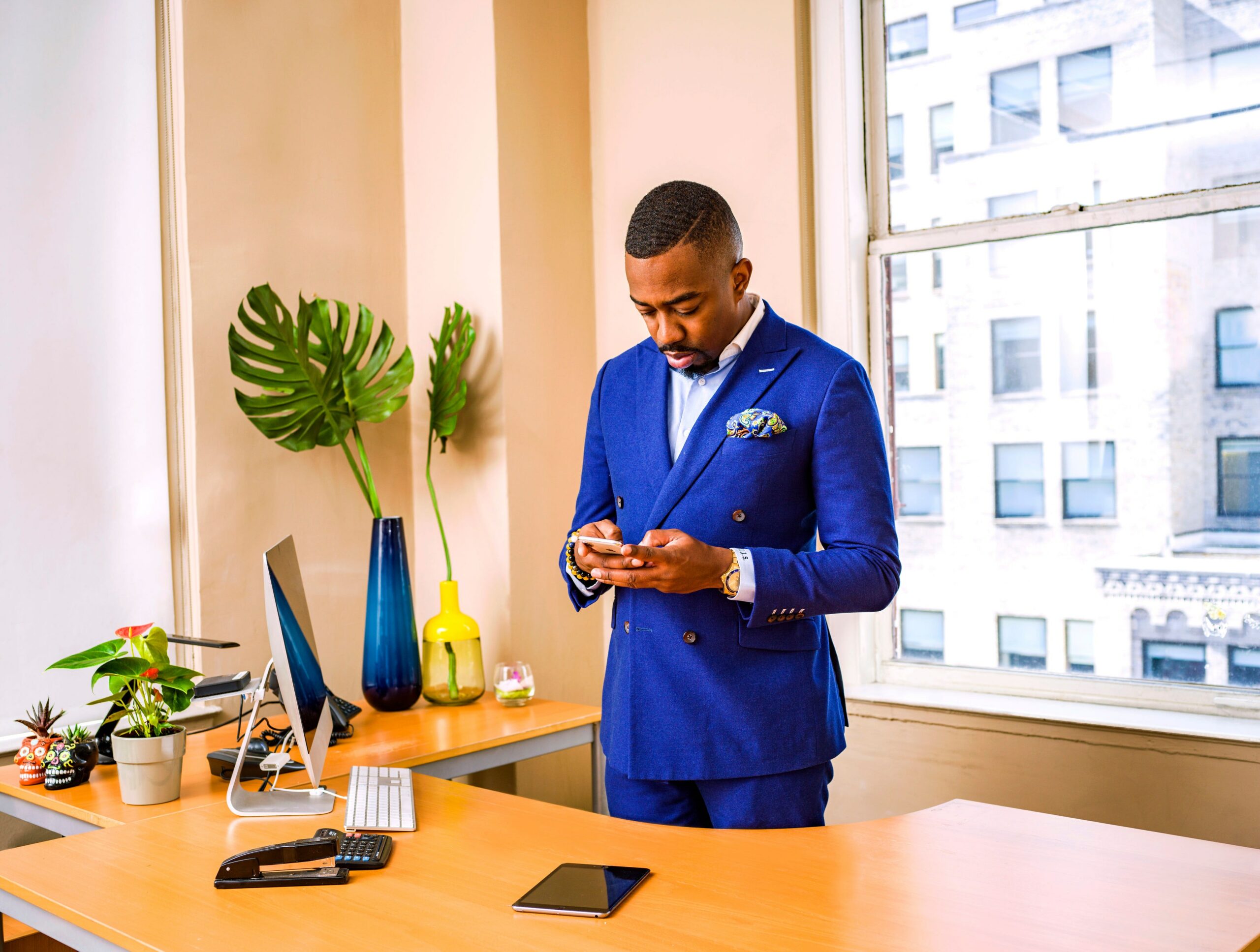 man-standing-while-using-phone