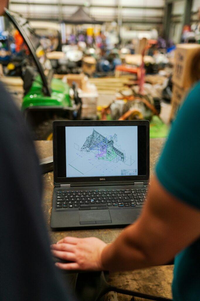 A person in blue shirt using black laptop computer SaaS companies hosting Kenya